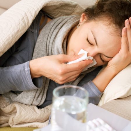person in bed with flu